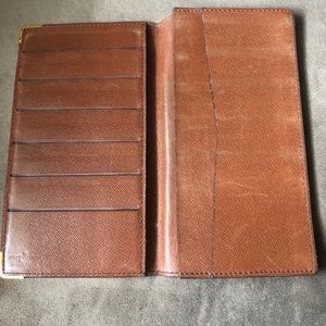 Louis Vuitton planner cover or checkbook holder.